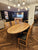 Handcrafted solid oak oval dining table with star/spider base in choice of 4 finishes